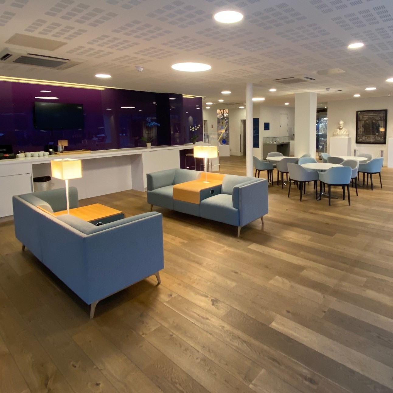 View of the seating at RPS London Reception including two sofas and three tables