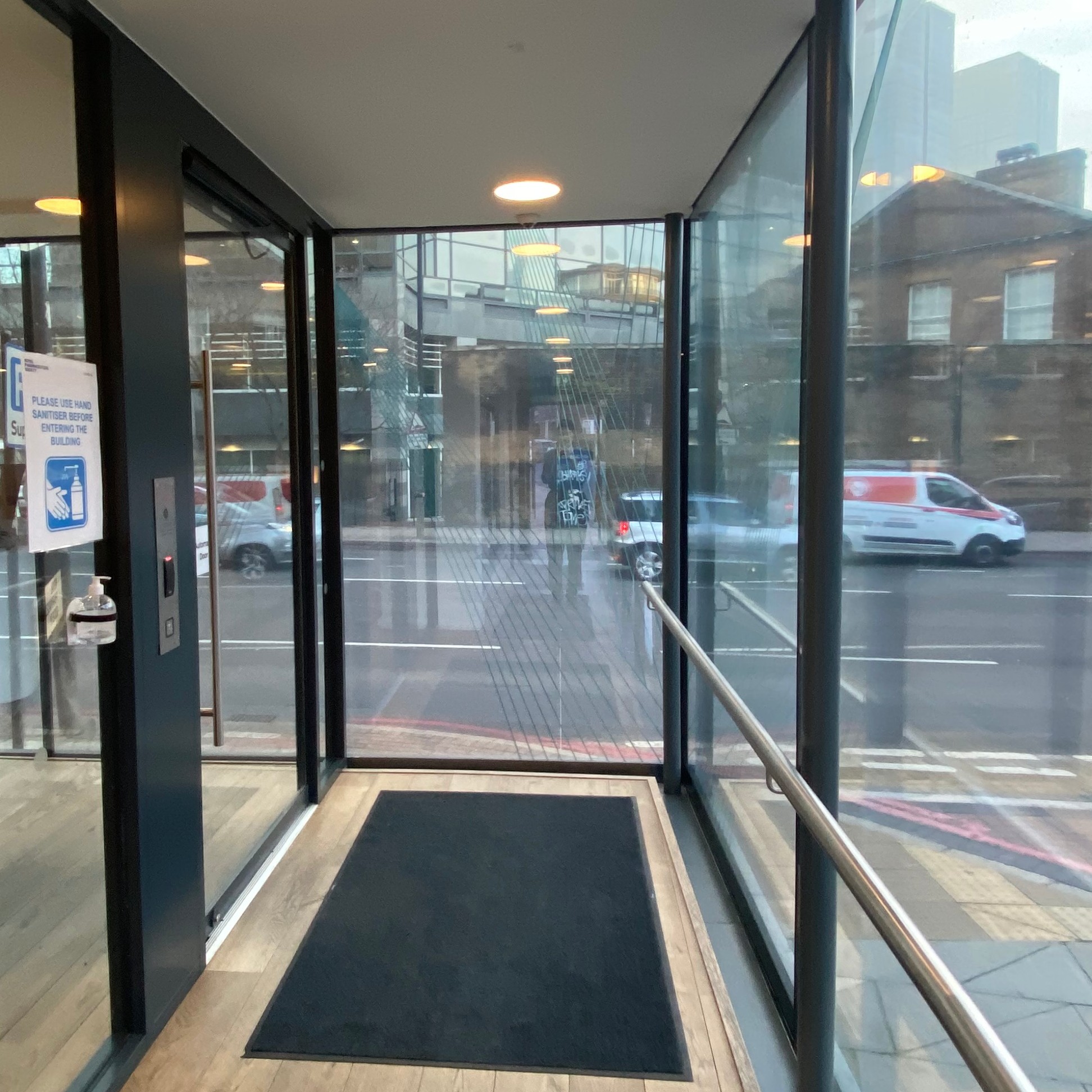 View of internal front door with doorbell on the left hand side. 
