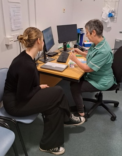 Patient speaking to Pharmacy Technician